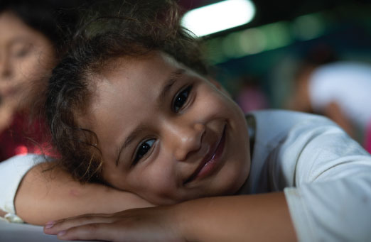 girl resting head on desk