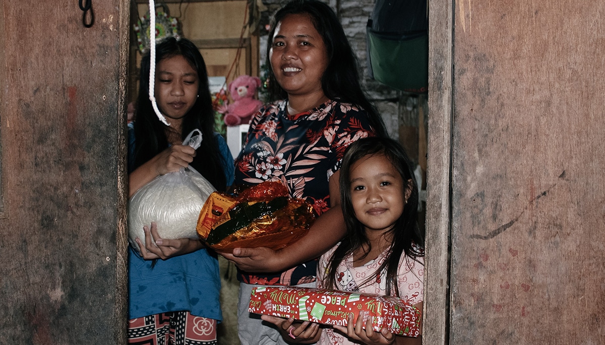 Christmas in the Philippines - happy family with gifts