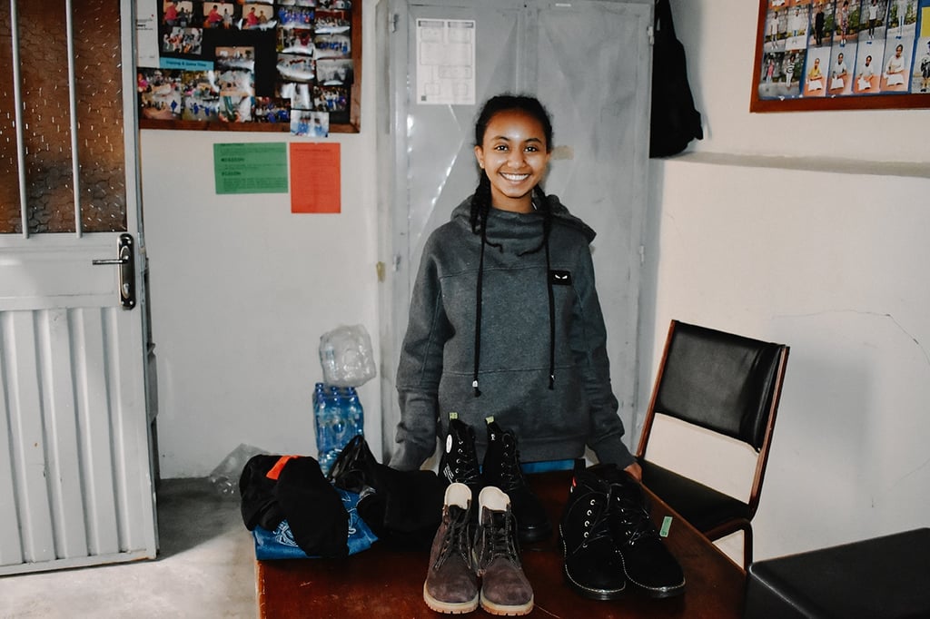 A sponsored girl in Ethiopia rejoices at a opportunity she received to pursue her education comfortably, despite living in poverty