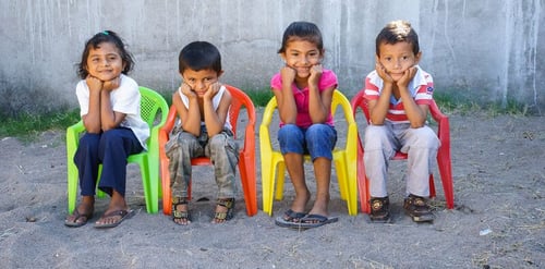 Tender Heart, Powerful Influence kids in colorful chairs