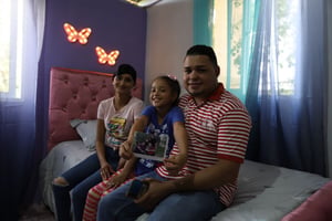 Fariely and her family in her new room