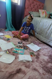 Fariely and her family in her new room