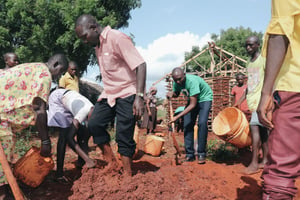 Field Office help rebuild a house for sponsored child