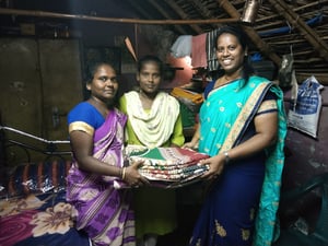 IN C Bhuvaneshwarireceiving bed and linen from Child Champion Ms Sonia