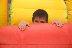 young boy in bouncy house