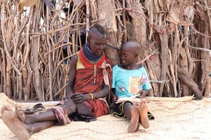 Namekwi reads Turknana Bible to her grandma