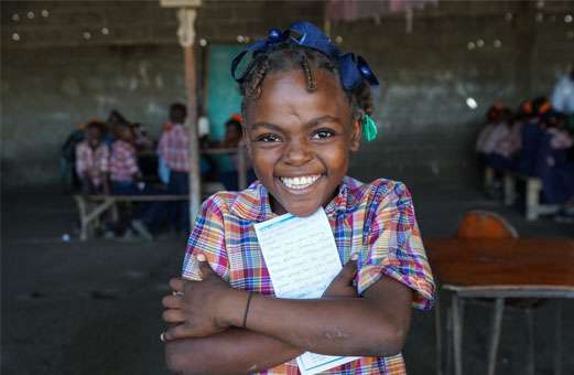 Sponsor smiling girl in Haiti