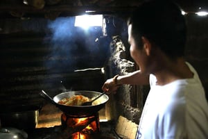 Lalyn helps by chopping the garlic ang onions for the pancit bihon
