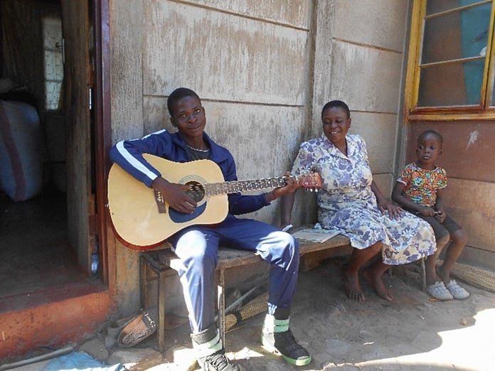 Evans playing guitar