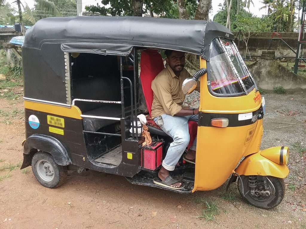 Ajith driving his autorickshaw