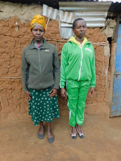 Kitayion, right, stands with her sister Ropian at home.