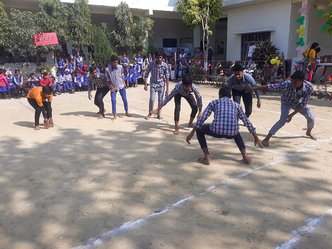 Boys playing game of tag called kho kho